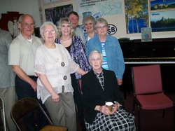 /images/1955_graduates_pose_with_sister_gavin_250x187.jpg